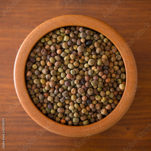 Legume Roveja seeds on a wooden jar photo