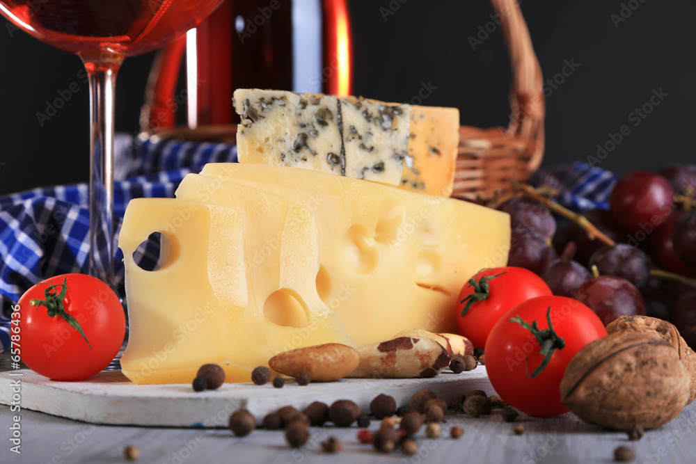 Different kinds of cheese with wine on table close-up Different kinds of cheese with wine on table close-up