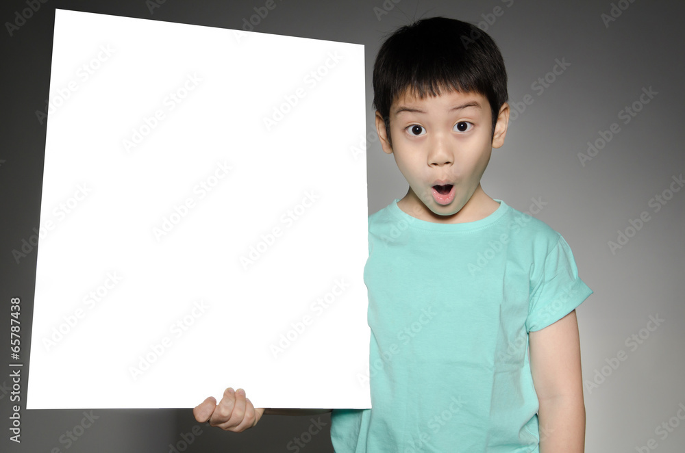 Asian cute boy with big white blank plate for add your text . Asian cute boy with big white blank plate for add your text .