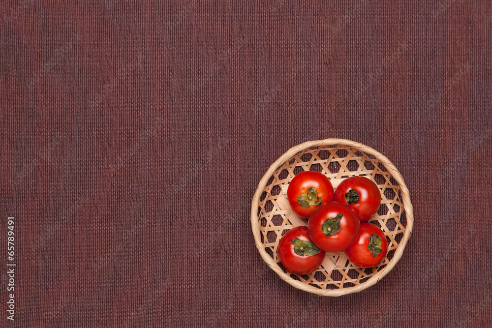 tomatoes on the table and put it in a basket tomatoes on the table and put it in a basket