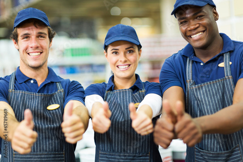 group of supermarket workers thumbs up