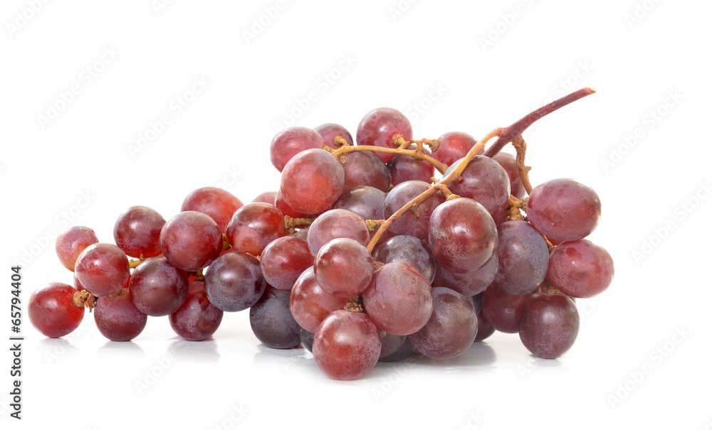 Fresh red grapes isolated on white background.