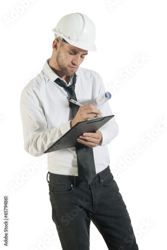 Young handsome technician writing notes on clipboard