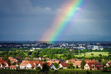 Colorful rainbow over the village