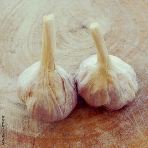 garlic on wood retro-vintage style photo