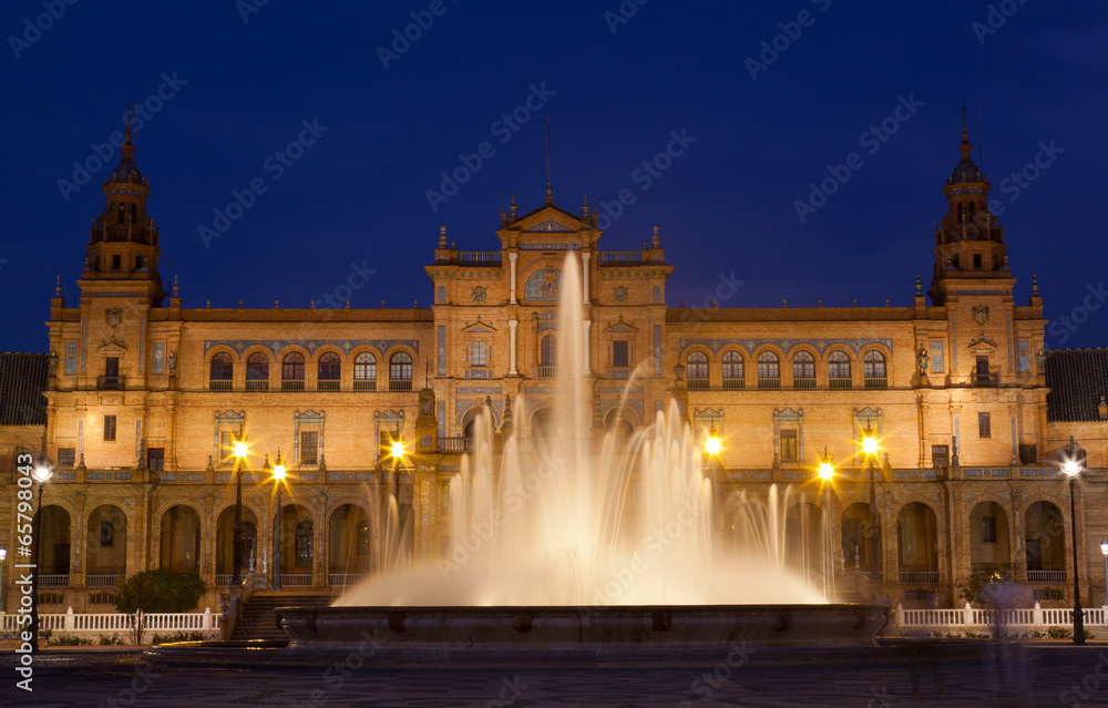 Plaza de Espana in Seville at night, fountain with illumination