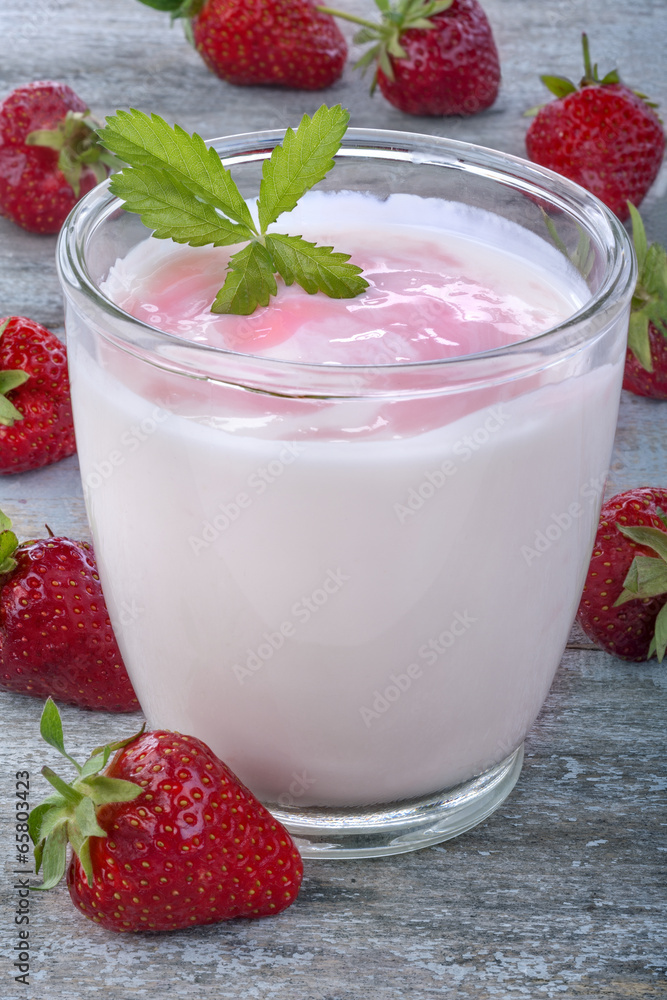 Fresh yogurt with strawberries on a rustic table Fresh yogurt with strawberries on a rustic table