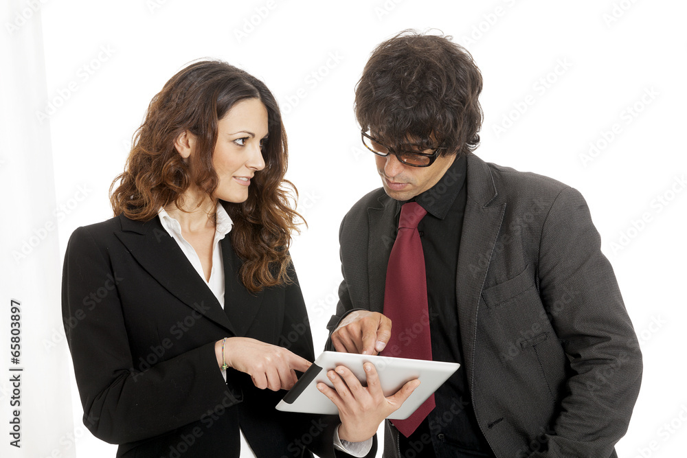 Businessman and businesswoman using a tablet computer Businessman and businesswoman using a tablet computer