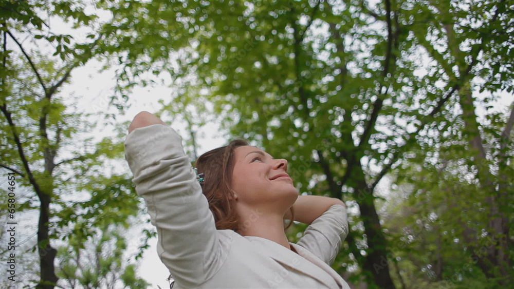 young, beautiful woman enjoying the fresh air in the forest young, beautiful woman enjoying the fresh air in the forest