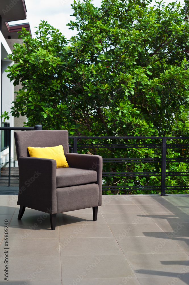 Outdoor patio seating are with nice Rattan sofa at sunset Outdoor patio seating are with nice Rattan sofa at sunset