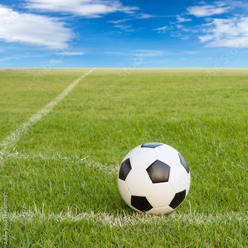 soccer ball on soccer field against blue sky © Satit _Srihin