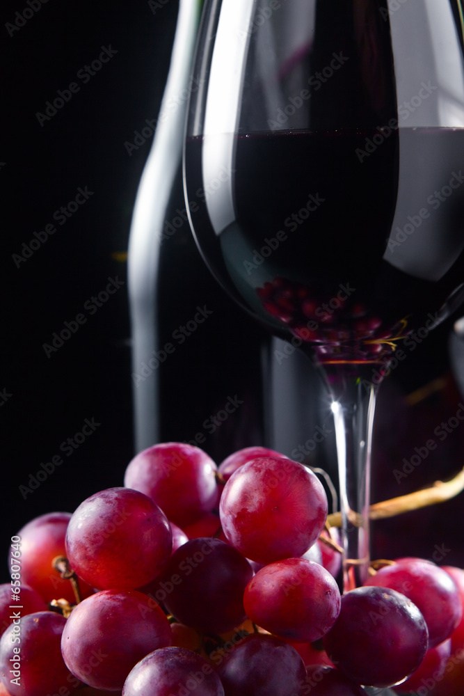 grape and glass with red wine grape and glass with red wine
