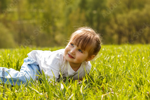 Baby lying on the grass in the park