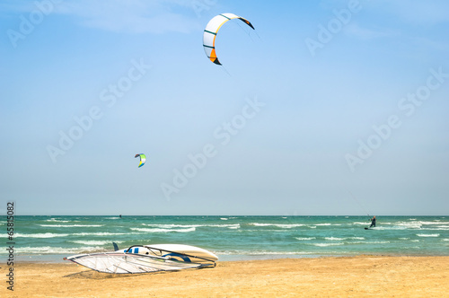 Photography Kite surfing at tropical beach with windsurf board