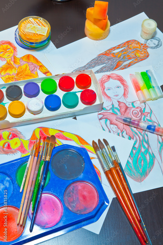 Naklejka premium brushes and colored paint artist on gray background