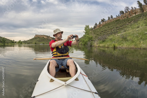 canoe paddler photographing