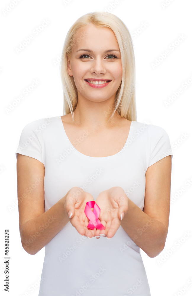 woman holding pink cancer awareness ribbon woman holding pink cancer awareness ribbon