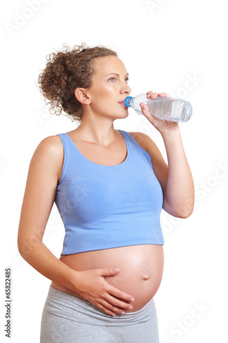 Pregnant woman drinking water photo