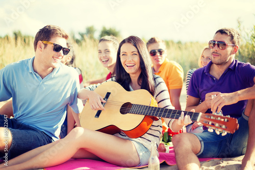 group of friends having fun on the beach