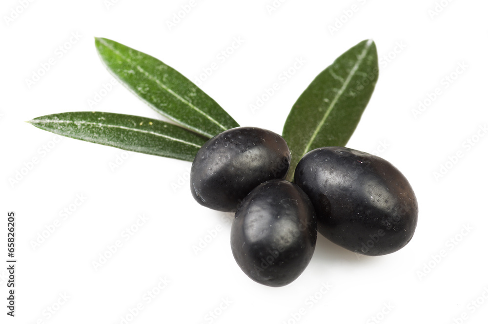 Black olive and leaves on the white Black olive and leaves on the white