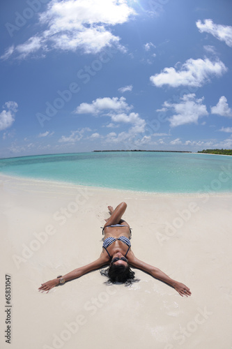 beautiful young woman on beach have fun and relax