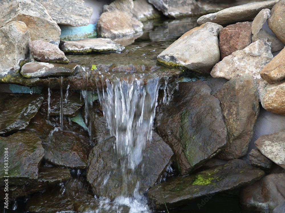 Manmade rock waterfall fountain pond outdoors moss Manmade rock waterfall fountain pond outdoors moss