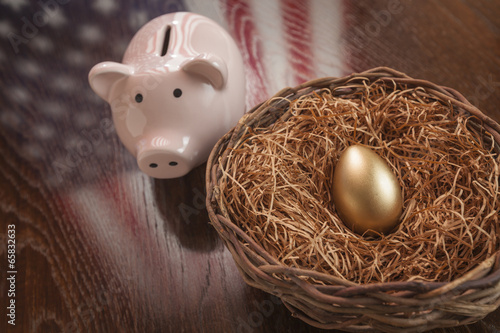 Golden Egg, Nest and Piggy Bank with American Flag Reflection