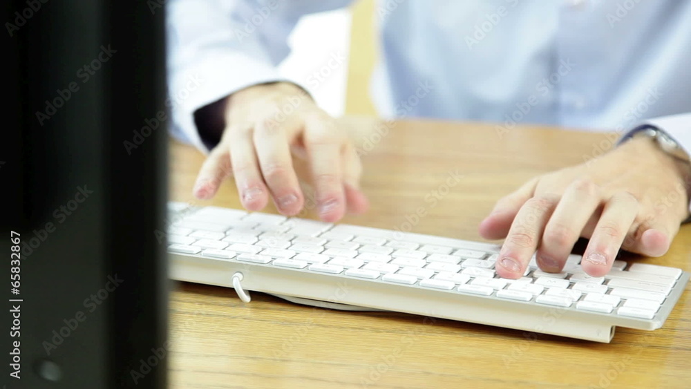 business man typing on the computer keyboard business man typing on the computer keyboard