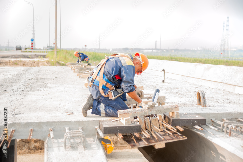 Workers on bridge construction