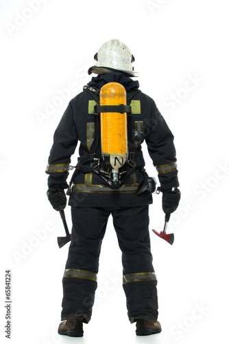 Firefighter with axe and oxygen balloon isolated on white