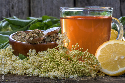 Domestic healthy elder tea on a rustic wooden table