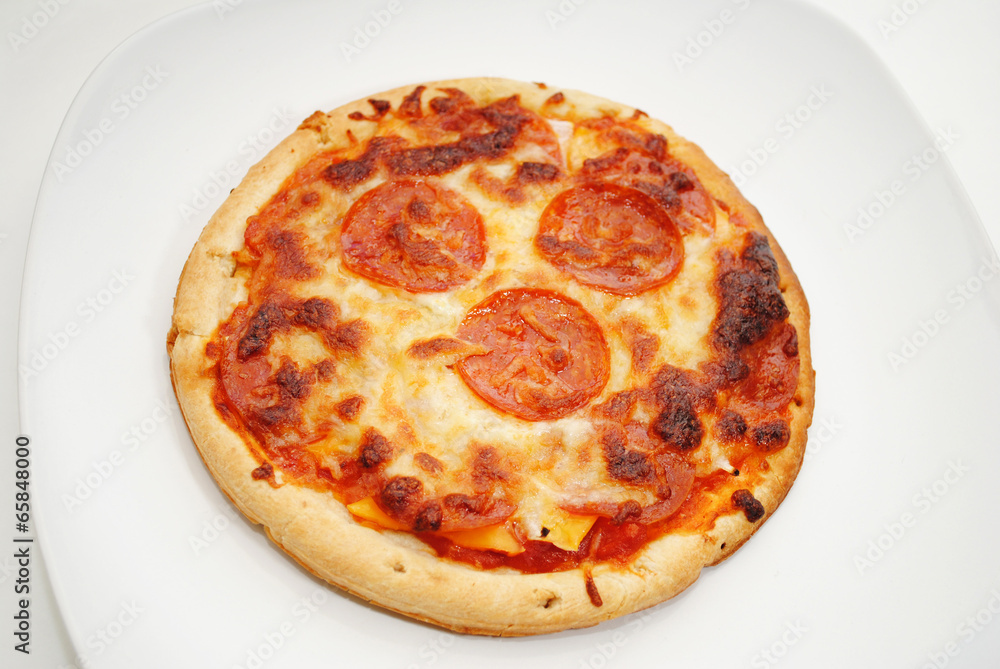 Personnal Size Pepperoni Pizza Served on a Plate
