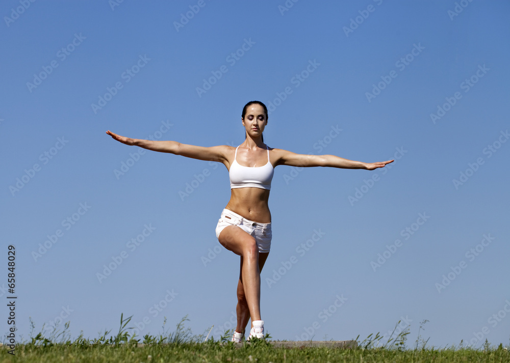 Fitness woman exercising in summer park Fitness woman exercising in summer park