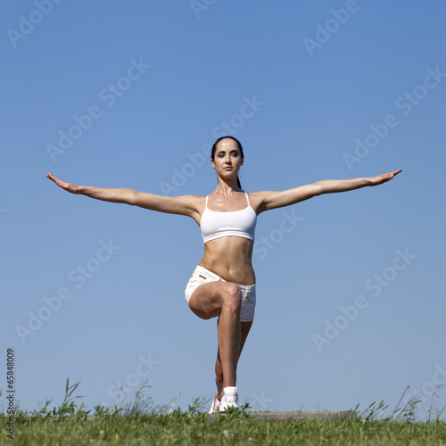 Fitness woman exercising in summer park