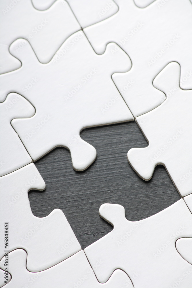 Jigsaw with Blank white pieces and one part missing Jigsaw with Blank white pieces and one part missing