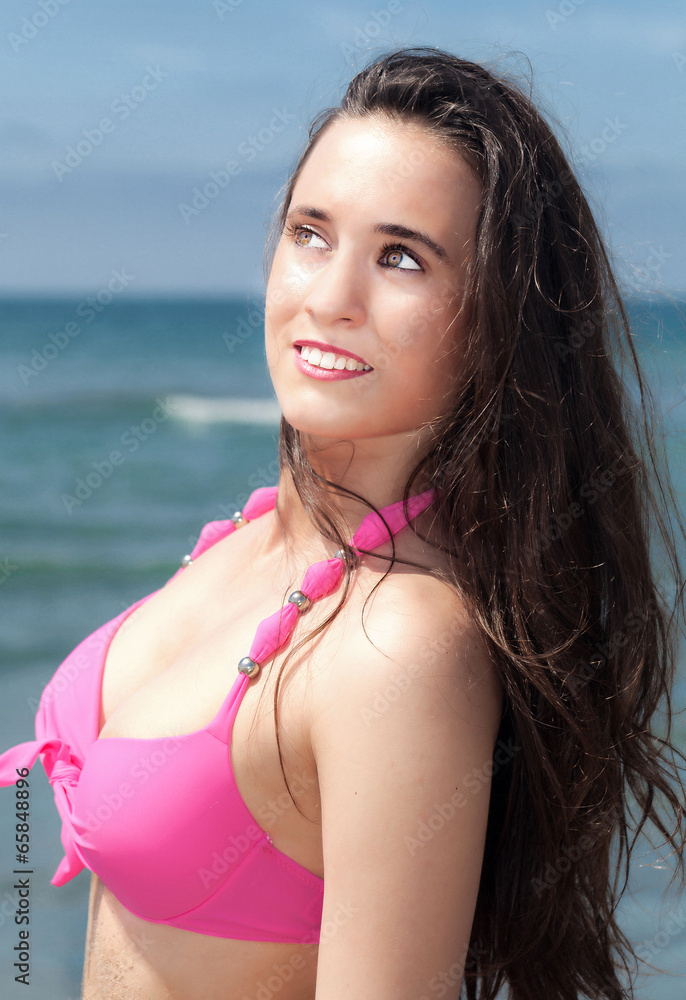 Girl in a swimsuit at the beach. Girl in a swimsuit at the beach.