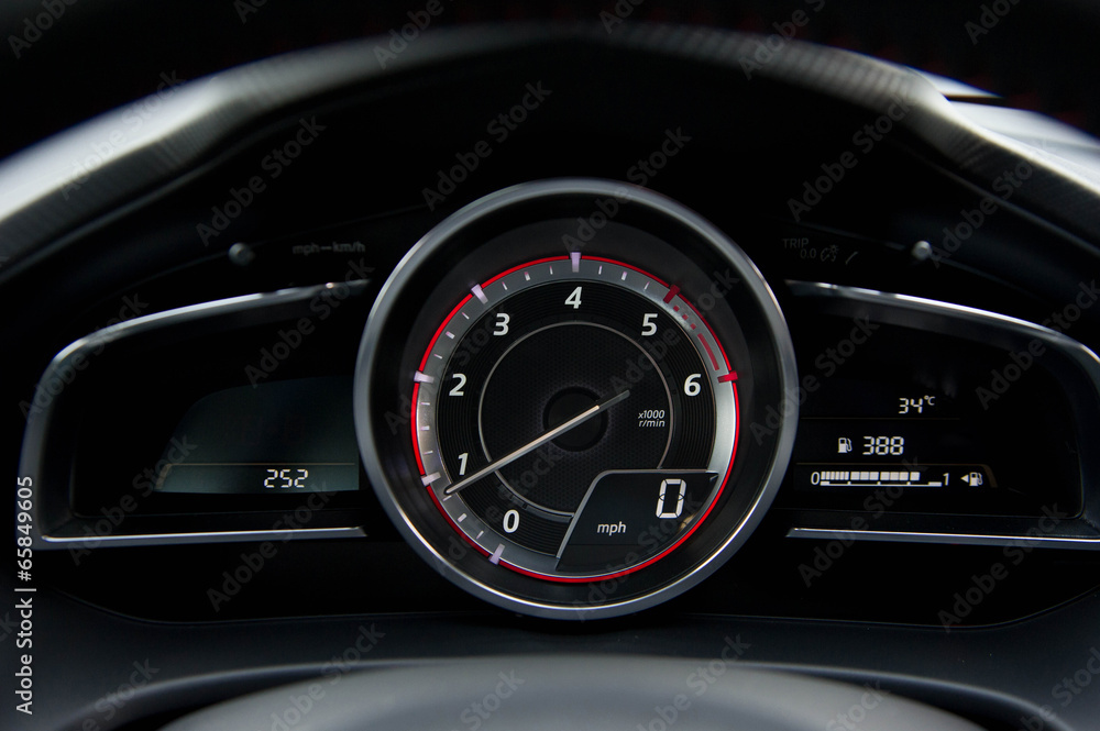 Close up of car dashboard and Odometer.