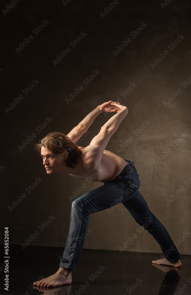 Young and stylish modern dancer on grey background Young and stylish modern dancer on grey background