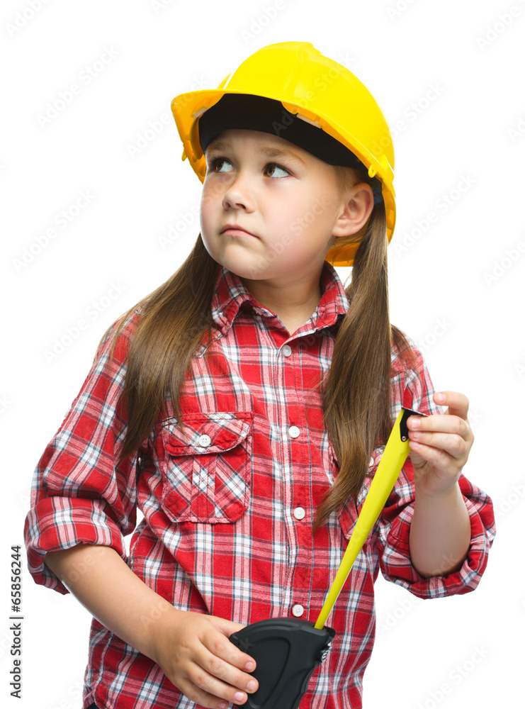Girl as a construction worker with tape measure Girl as a construction worker with tape measure