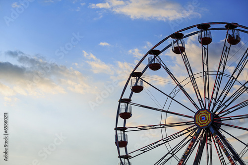 Ferris wheel on the background of sky photo