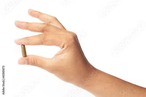 Hands with a pill herb