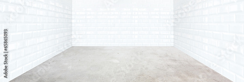 white brick tile room with cement floor