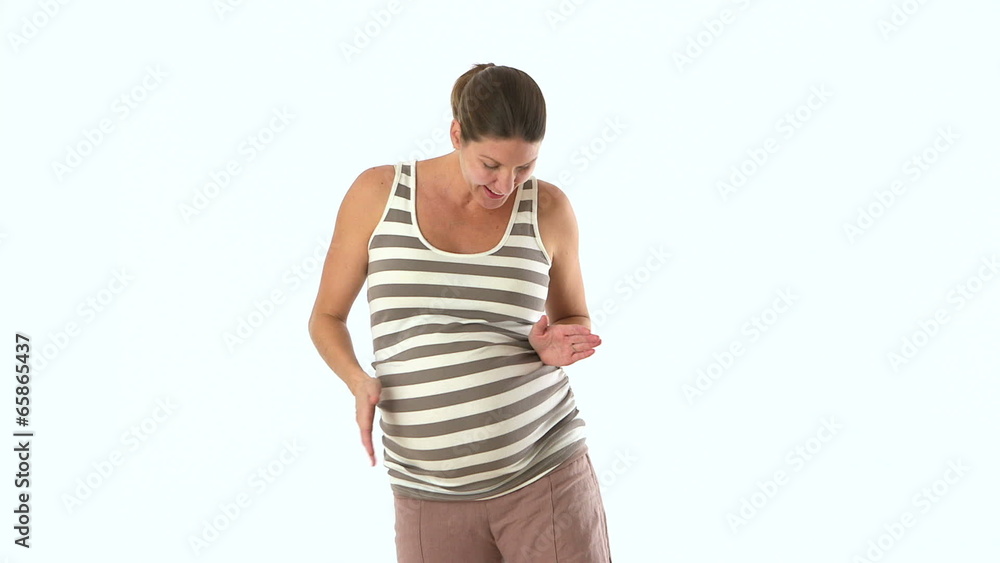 Medium shot of pregnant mother revealing belly Medium shot of pregnant mother revealing belly