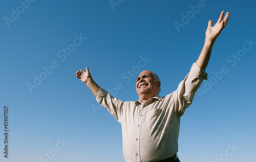 Senior retired man rejoicing in the sunshine