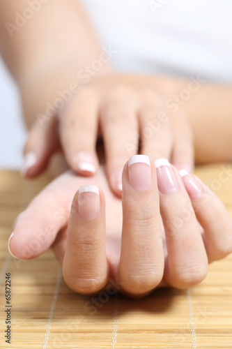 Close up of a beautiful woman hand french manicure