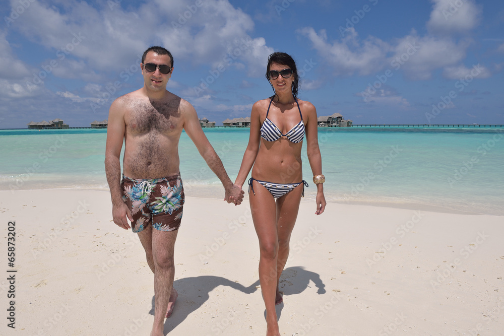 happy young couple have fun on beach happy young couple have fun on beach
