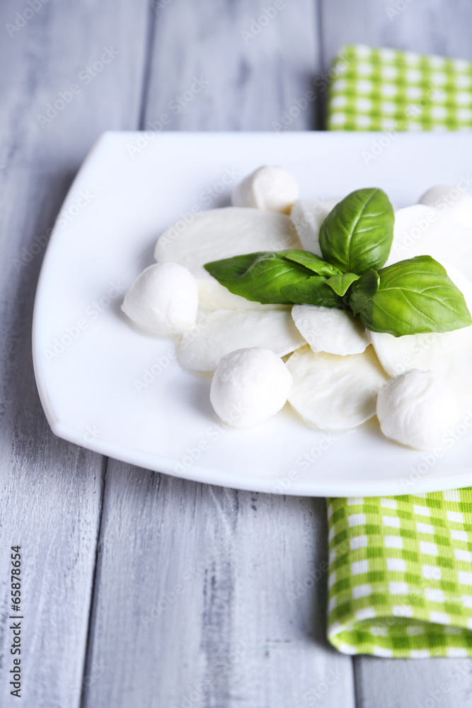 Tasty mozzarella cheese with basil Tasty mozzarella cheese with basil