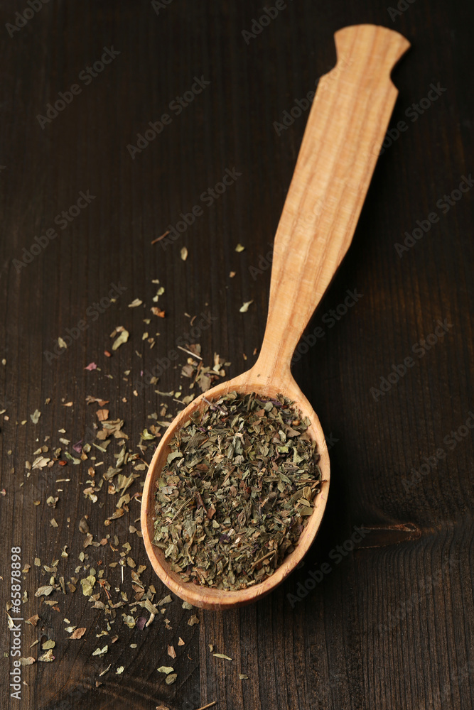 Spice greens in spoon on wooden background Spice greens in spoon on wooden background