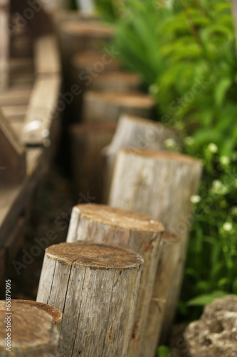 Old wooden fence in the garden © Africa Studio