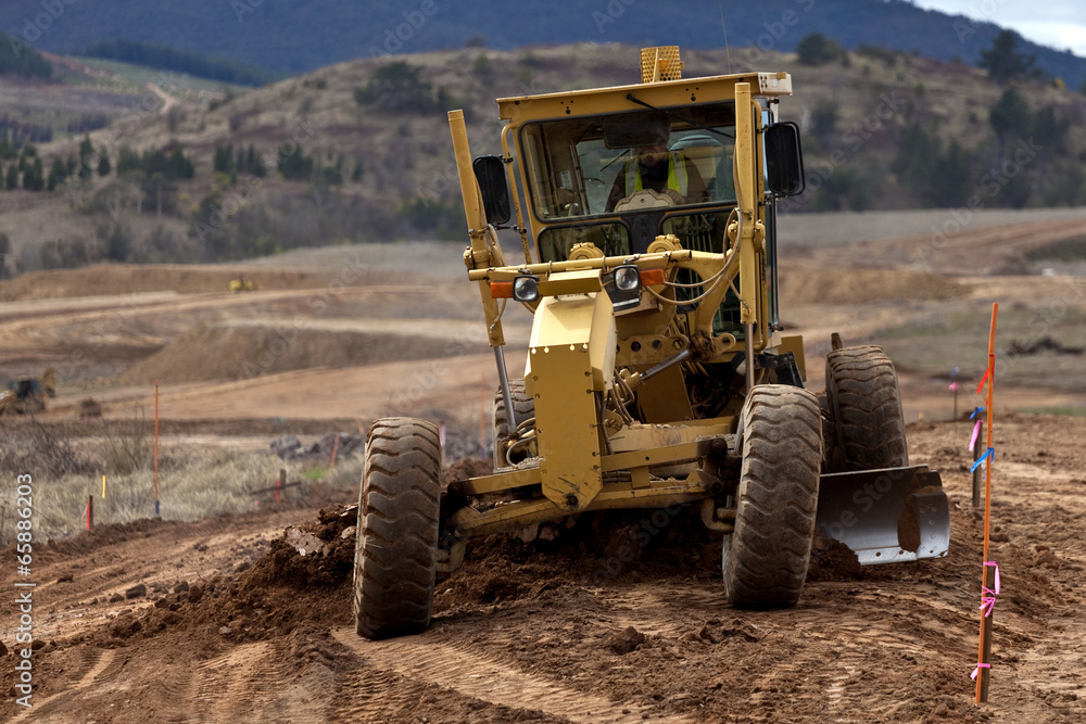 Earth moving equipment working on new housing project Earth moving equipment working on new housing project
